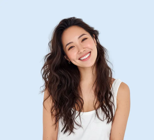 Smiling young woman, illustrating discreet InSmile™ lingual braces